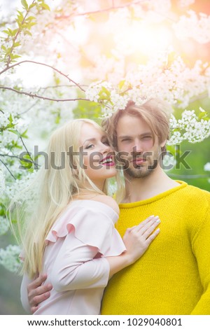 https://thumb7.shutterstock.com/display_pic_with_logo/2810074/1029040801/stock-photo-man-and-woman-in-spring-easter-couple-in-love-in-blossoming-flower-spring-spring-nature-1029040801.jpg