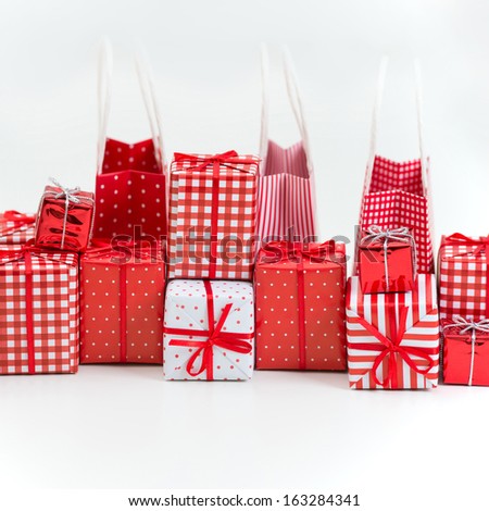 gift boxes with xmas presents wrapped in red paper with ornament on white background - Xmas Presents gift boxes with xmas presents wrapped in red paper with ornament on white background - Xmas Presents