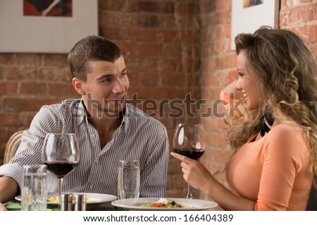 https://thumb7.shutterstock.com/display_pic_with_logo/282061/166404389/stock-photo-young-happy-couple-on-romantic-date-drinking-glass-of-red-wine-at-restaurant-celebrating-valentine-166404389.jpg