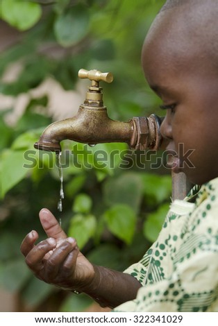 Beautiful African Child Drinking Tap Water Stock Photo 276445445 ...