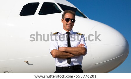 Kiev, Ukraine - OCTOBER 10, 2014: Airline pilot standing near aircraft.