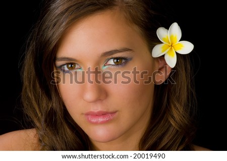 https://thumb7.shutterstock.com/display_pic_with_logo/283900/283900,1225878311,1/stock-photo-beautiful-island-girl-with-frangipani-flower-behind-her-ear-20019490.jpg