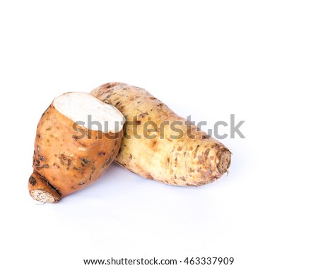 Close-up top view whole raw sweet potato yam (Ipomoea batatas) and slice cut isolated on white background. It is fresh pick from garden at Thai Binh, Viet Nam. Organic food concept with copyspace