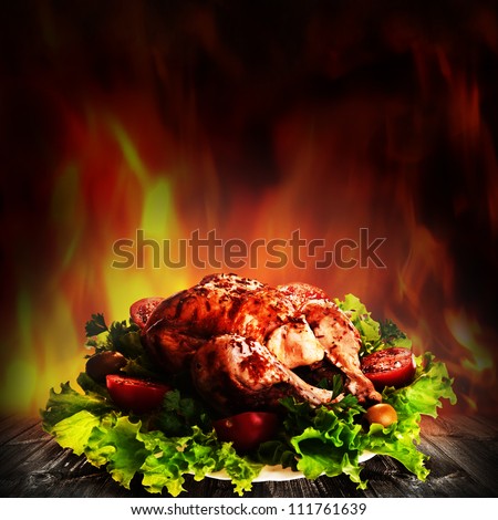 Grilled chicken over salad on the wooden desk - stock photo