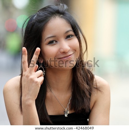 stock photo pretty young smiling asian woman on the street 42468049 - Oriental Marriage Practices