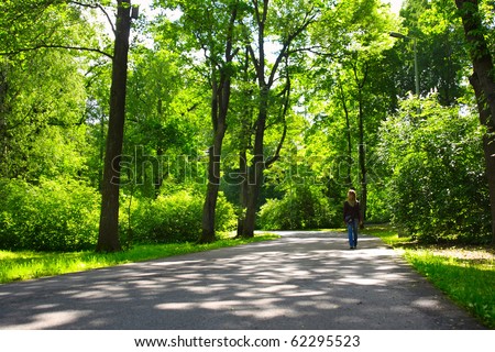 https://thumb7.shutterstock.com/display_pic_with_logo/295900/295900,1286207983,1/stock-photo-woman-walking-on-asphalt-road-in-green-park-62295523.jpg