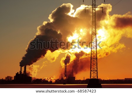 Power plant with huge smoke and electric towers