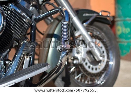 Subotica, Serbia-February 25,2017:Green Yamaha DragStar 1100 motorcycle in front of the garage, photographed on a nice sunny day. Ready for restoration. Lot of chrome detail.