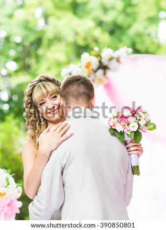 https://thumb7.shutterstock.com/display_pic_with_logo/2984797/390850801/stock-photo-happy-newlywed-romantic-couple-dancing-at-wedding-aisle-with-pink-decorations-and-flowers-390850801.jpg