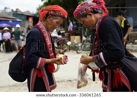 HA GIANG, VIETNAM - SEPTEMBER 20, 2015: Unidentified people of diferent ethnic groups in Lung Phin market. Lung Phin market is one of the most typical hill tribe markets in Vietnam.