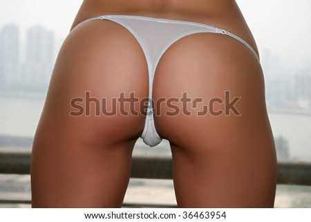 beautiful bottom with a nice white cute string and perfect skin. some people call this a "perfect ass" sorry for this bad word