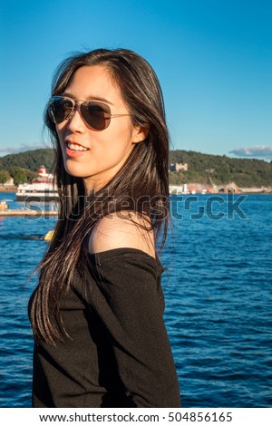 https://thumb7.shutterstock.com/display_pic_with_logo/3023354/504856165/stock-photo-beautiful-asian-young-woman-happy-asian-girl-travel-in-europe-beautiful-asian-lady-in-black-504856165.jpg