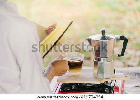Woman Pouring Strong Coffee From Moka Pot Vintage Italian Maker To The Small Cup Woman Pouring Strong Coffee From Moka Pot Vintage Italian Maker To The Small Cup