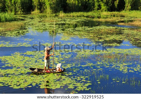 Vanlong, Ninhbinh, Vietnam - Sept 23, 2015: Life at nature reserve of VanLong wetlands - areas lagoon VanLong. Unidentified fisherman fishing reviews.