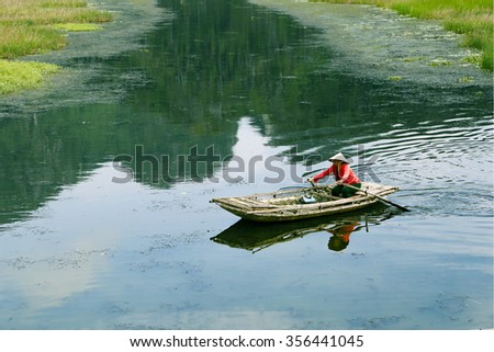Vanlong, Ninhbinh, Vietnam - Nov 08, 2015: Life at nature reserve of VanLong wetlands - areas lagoon VanLong. Traveling by boat is very common in Vietnam