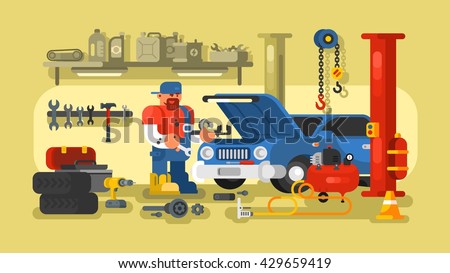 Mechanic Repairs Car in the Garage