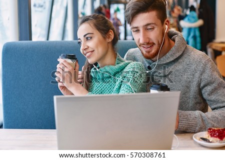https://thumb7.shutterstock.com/display_pic_with_logo/309106/570308761/stock-photo-man-and-woman-drinking-coffee-and-eating-desert-in-a-cafe-two-people-man-and-woman-with-laptop-in-570308761.jpg