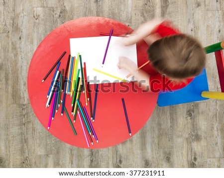 A studio photo of a childs table and chair