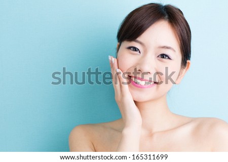 https://thumb7.shutterstock.com/display_pic_with_logo/310660/165311699/stock-photo-attractive-asian-woman-skin-care-image-isolated-on-blue-background-165311699.jpg