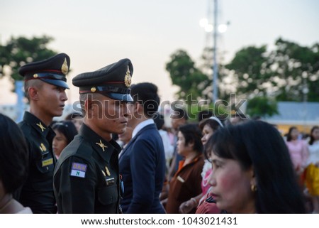 March 3, 2018. Two army infantry officers in official dress uniforms march through a crowd at the Ananta Samakhom Throne Hall, Bangkok, Thailand. Travel and security editorial.