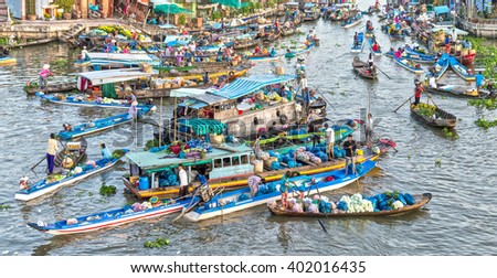 Soc Trang, Vietnam - February 3rd, 2016: Early Market on confluence with boatload agricultural between river gathered to sales, far away boat trip reverse sweep beautiful idyllic in Soc Trang, Vietnam