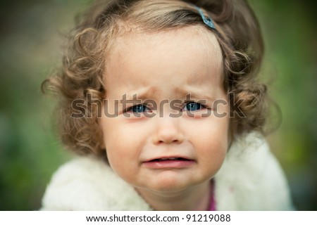 portrait of a crying little girl