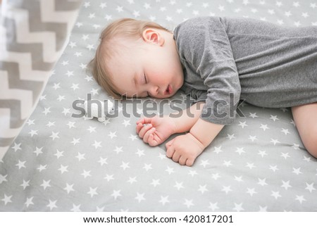 Baby sleeping in bed