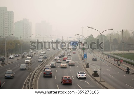 BEIJING, CHINA - NOVEMBER 14, 2015: Zhongguancun street in beijing during air pollution. Air pollution is a serious problem in Beijing.