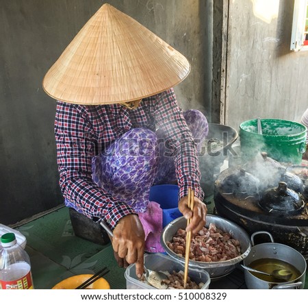 Mui Ne, Vietnam - Mar 19, 2016. A woman cooking street foods in Mui Ne township, Phan Thiet, Vietnam.