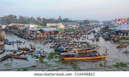 Soc Trang, Vietnam - Feb 2, 2016. People at Nga Nam floating market, group of rowing boat on river in Soc Trang, Vietnam.