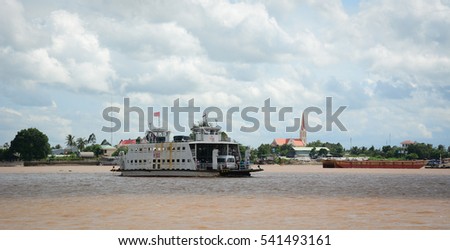 An Giang, Vietnam - Aug 7, 2016. A ferry on the Bassac River in Southern Vietnam. The Bassac River is the first and main distributary of the Mekong.