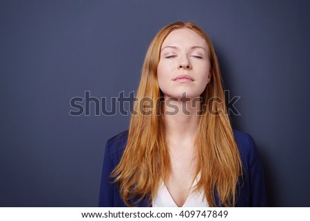 https://thumb7.shutterstock.com/display_pic_with_logo/321598/409747849/stock-photo-attractive-young-woman-enjoying-a-quiet-moment-standing-meditating-with-her-eyes-closed-and-head-409747849.jpg