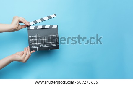 movie clapper on blue background, cinema concept