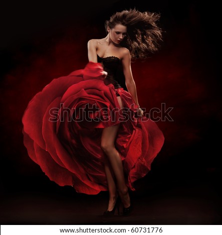 Beautiful dancer wearing red dress - stock photo