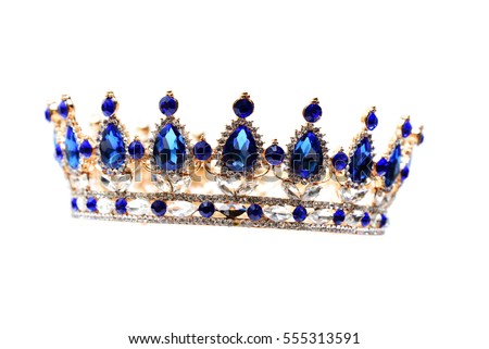 Gold crown with blue jewel of precious stones.