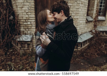 https://thumb7.shutterstock.com/display_pic_with_logo/3292109/558697549/stock-photo-stylish-man-and-woman-kissing-romantic-calm-atmospheric-moment-couple-hugging-gently-in-autumn-558697549.jpg