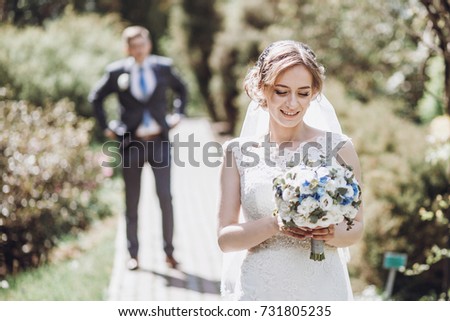 https://thumb7.shutterstock.com/display_pic_with_logo/3292109/731805235/stock-photo-beautiful-gorgeous-bride-and-groom-walking-in-sunny-spring-park-and-enjoying-day-happy-wedding-731805235.jpg