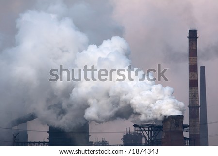 Plant with smoke. Air pollution