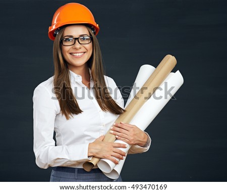 Portrait of architect student woman with blueprints protect helmet wearing. Black background.