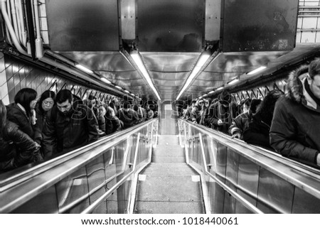 USA/NEW YORK - 3 JAN 2018 - people in the daily life of the New York subway. Climbing Stairs.