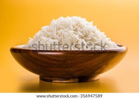 indian basmati rice, pakistani basmati rice, asian basmati rice, cooked basmati rice, cooked white rice, cooked plain rice in wooden bowl over yellow background