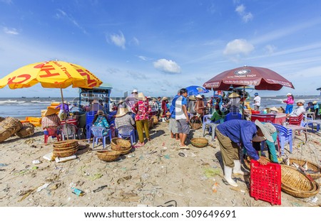 VUNG TAU, VIETNAM - AUG 23,2015: Fishermen on beach at the Fishing Village Long Hai, Vietnam.