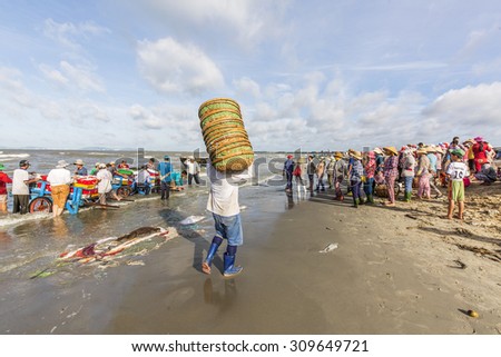 VUNG TAU, VIETNAM - AUG 23,2015: Fishermen on beach at the Fishing Village Long Hai, Vietnam.