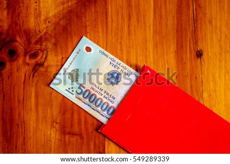 Habit, custom of Vietnamese on Tet is lucky money, a Vietnam traditional culture, child wish somebody a happy new year, receive red envelope with new small change, Tet on spring, also lunar new year