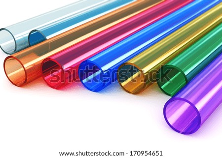 Macro view of set of color transparent acrylic plastic tubes isolated on white background with selective focus effect