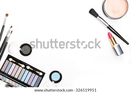 Brush and cosmetic isolated on a white background. Top view.