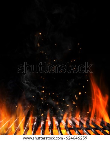 Empty flaming charcoal grill with open fire, ready for product placement. Concept of summer grilling, barbecue, bbq and party. Black copyspace