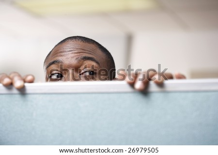 stock-photo-businessman-peeking-over-cubicle-wall-26979505.jpg