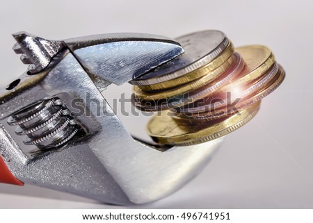 https://thumb7.shutterstock.com/display_pic_with_logo/3567263/496741951/stock-photo-wrench-and-coins-the-concept-of-a-permanent-and-stable-prices-496741951.jpg