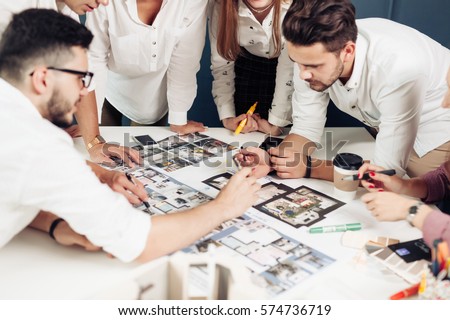 Team of architects working on construction plans